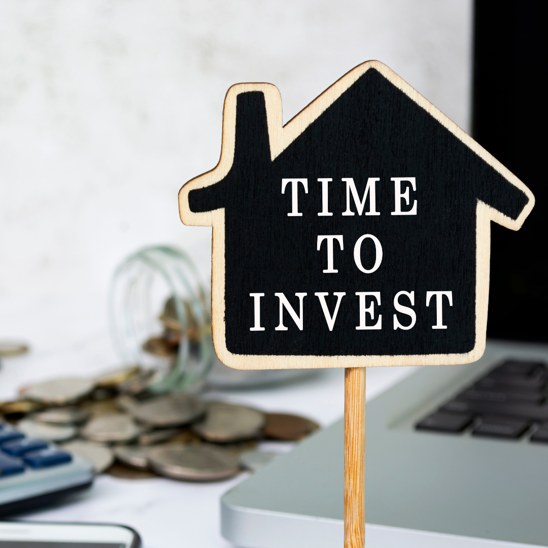 a homw billbooard with a sign time to invest.